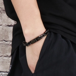 Close-up of black rock hip-hop style stainless steel king chain bracelet for men