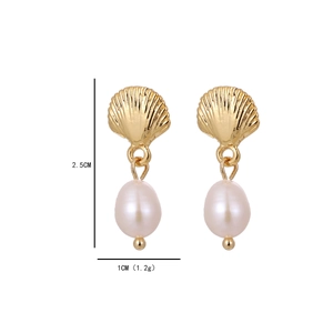 Detail shot of gold shell earrings with teardrop pearls showing 2.5cm height dimension