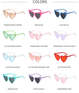 Macro view of heart-shaped sunglasses in 12 assorted glitter and transparent colors