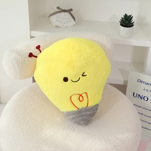Detailed view of yellow plush bulb toy with cute winking expression and red heart antenna