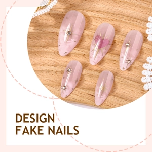 Pink heart almond press-on nails with sparkling rhinestones and gold star accents