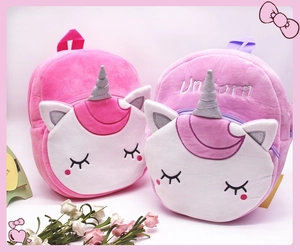 Detailed side view of pink and purple plush unicorn backpacks with soft texture and horn