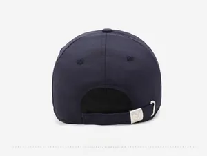 Detail view of the back of blue winter baseball cap with adjustable metal buckle closure