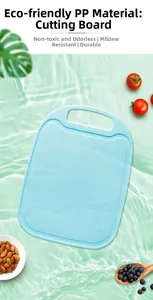 Close-up of light blue PP cutting board with anti-slip texture and drainage grooves