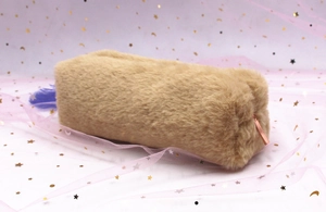 Detail of plush pencil case with camel faux fur texture and rose gold zipper pull