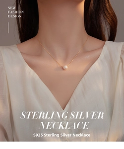 Detailed close-up of a round pink shell pearl pendant on an S925 silver necklace