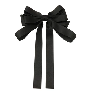 Elegant large black French satin bow hair clip for women with minimalist aesthetic style