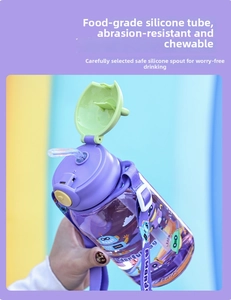 Detail of children's purple water bottle with robot print and food-grade silicone straw