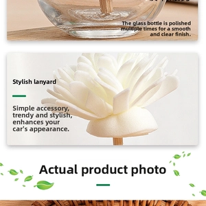 Detail of clear polished glass aromatherapy bottle with fiber flower diffuser and wood tray