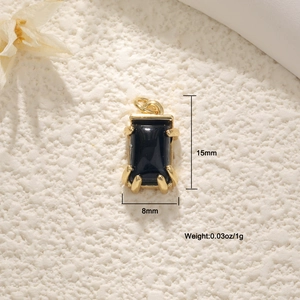 Detail shot of 18K gold plated heart pendant with black gemstone and size measurements