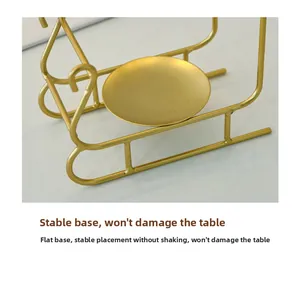 Detail of stable gold metal candle holder base with smooth matte finish for table safety
