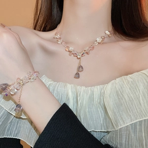 Elegant floral jewelry set with pink crystal flower petals and water drop tassels