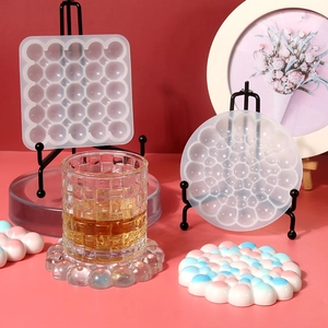 Detail view of square and round bubble pattern silicone molds for DIY resin coasters