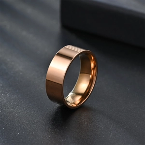 Macro shot of 8mm rose gold polished stainless steel ring with flat outer surface