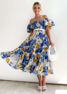 Detail of floral off-shoulder tiered dress with puffed sleeves and woven white waist belt