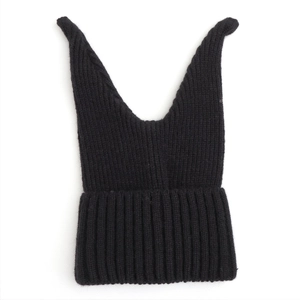 Detail of black ribbed knit beanie with cute cat ears showing soft yarn texture