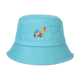 Close-up of rooster embroidery on light blue cotton bucket hat with parallel brim stitching