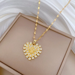 Gold plated titanium steel heart necklace featuring a bee motif and sparkling zircon stones