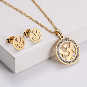 Golden titanium steel jewelry set featuring floral silhouette pendant and rhinestone earrings
