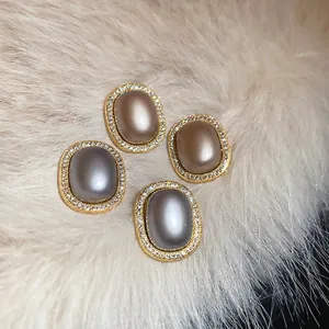 French vintage gold-plated oval stud earrings with pearls and crystals on plush fur