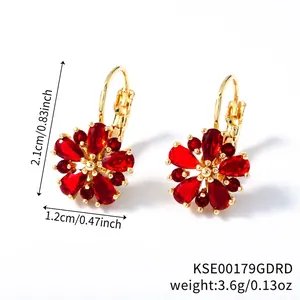 Detailed view of rose gold flower earrings with red crystals and dimensions 2.1cm by 1.2cm