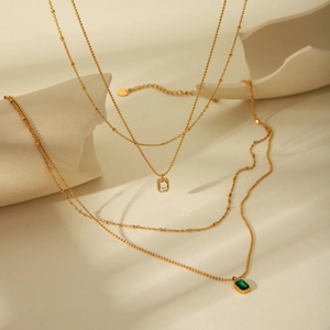 Double-layered 18k gold plated stainless steel necklace with green and white zircon pendants