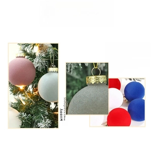 Detail of 8cm flocked Christmas tree ornaments with soft velvet texture and gold hanging loops