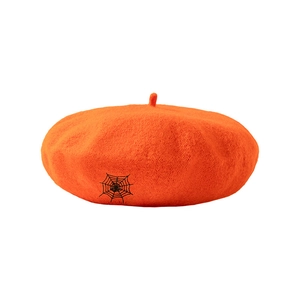 Orange wool beret with black spider web embroidery for a gothic and trendy autumn style