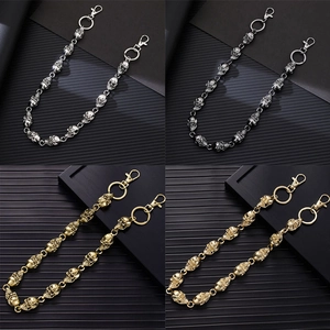 Detail showing skull head waist chains in silver, gun black, gold and antique gold metal