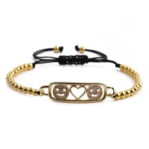 Goldenes Perlenarmband mit Herz- und Smiley-Platte an verstellbarer schwarzer Kordel