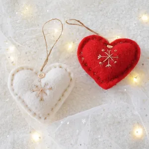 Handmade wool felt heart Christmas ornaments with snowflake embroidery and wood button