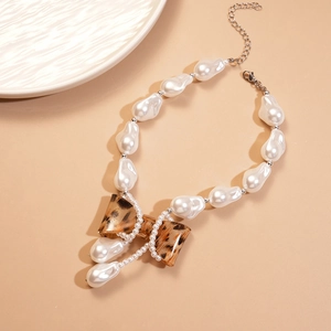 Baroque pearl necklace with leopard print bow pendant and silver metal chain clasp