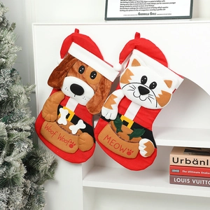 Christmas stockings set featuring 3D cartoon cat and dog plush designs on a white fireplace