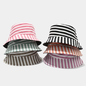 Detail showcasing variety of colorful striped bucket hats for sun protection and outdoor leisure