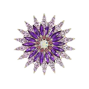 Elegant purple crystal flower brooch with gold alloy setting and radial gemstone design
