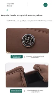 Detail of adjustable strap and round metal logo on dark brown sun visor hat