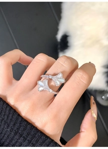 Close-up of a silver ginkgo leaf open ring with mother of pearl and pavé crystals