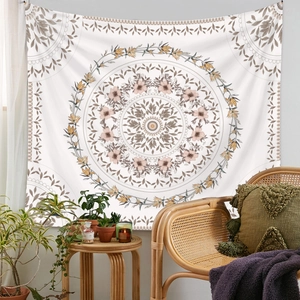 Close-up of bohemian mandala tapestry with intricate floral patterns in soft beige and brown
