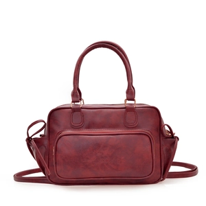 Vintage burgundy leather backpack with dual handles and spacious design for women