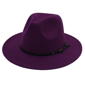 Close-up of deep purple wool fedora with black leather band and golden metal studs