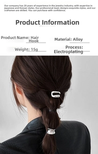 Detail of silver alloy hair hook with irregular texture and sleek metallic finish