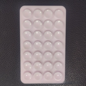 Detail of 28 square double-sided silicone suction pads for mobile phone anti-slip use