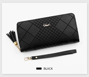 Close-up of black quilted long wallet with tassel zipper and leather wrist strap