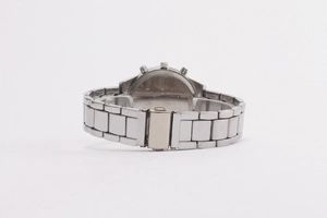 Detailed close-up of a silver metal link watch band with a secure folding clasp