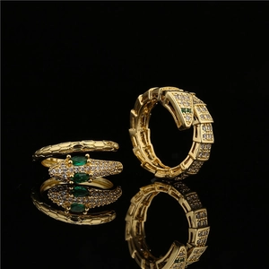 Vintage 18K gold plated snake ring with green emerald eyes and sparkling zircons