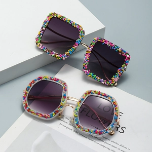 Cat eye sunglasses with colorful candy-style glitter frame and purple gradient lenses