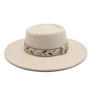 Detail of beige flat-top wool felt hat with ethnic woven band and 8.5cm wide brim