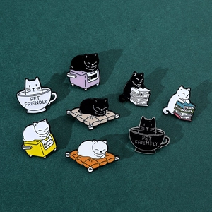 Detailed set of 8 cute cartoon cat enamel pins on dark green fabric background