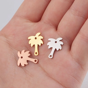 Three mirror-polished stainless steel coconut tree pendants in gold, silver and rose gold