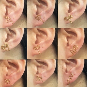 Golden stainless steel U-shaped fake nose rings and ear clips set on model